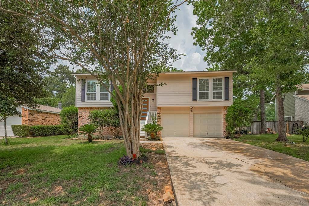 This nicely landscaped yard has trees in the front and the back. And don't forget the park and walking path are just behind this property.