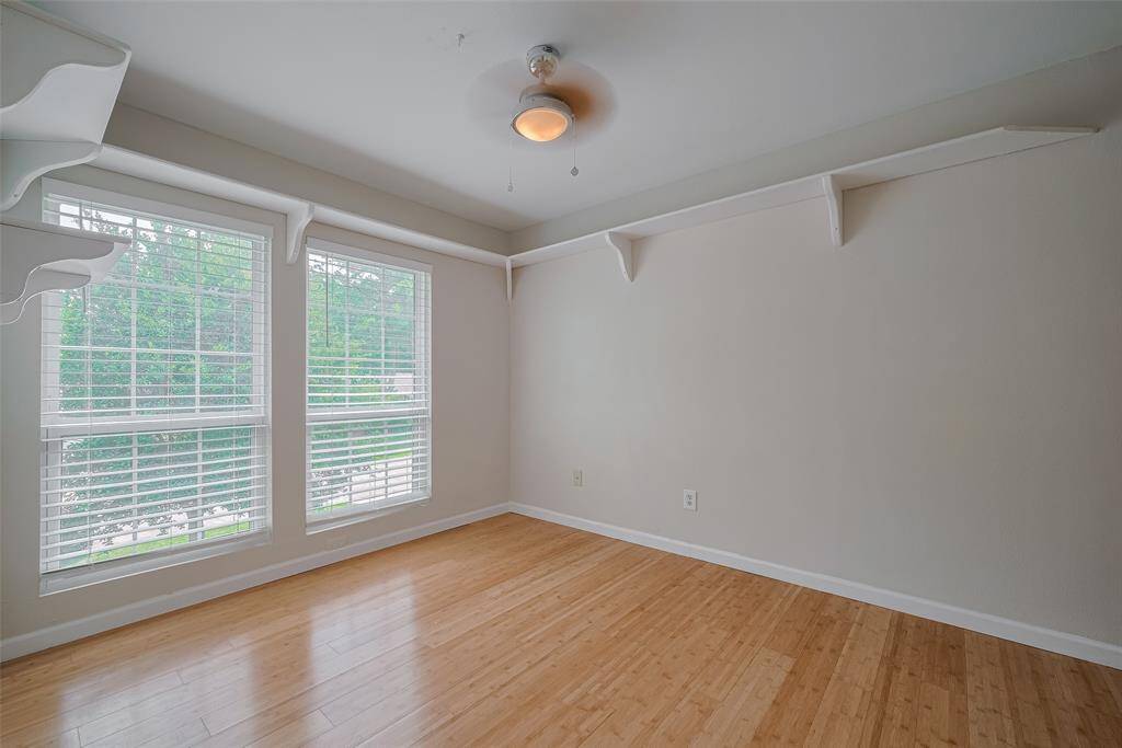 Bedroom #3 is on the front of the house with a double picture window and a cute shelf around the room