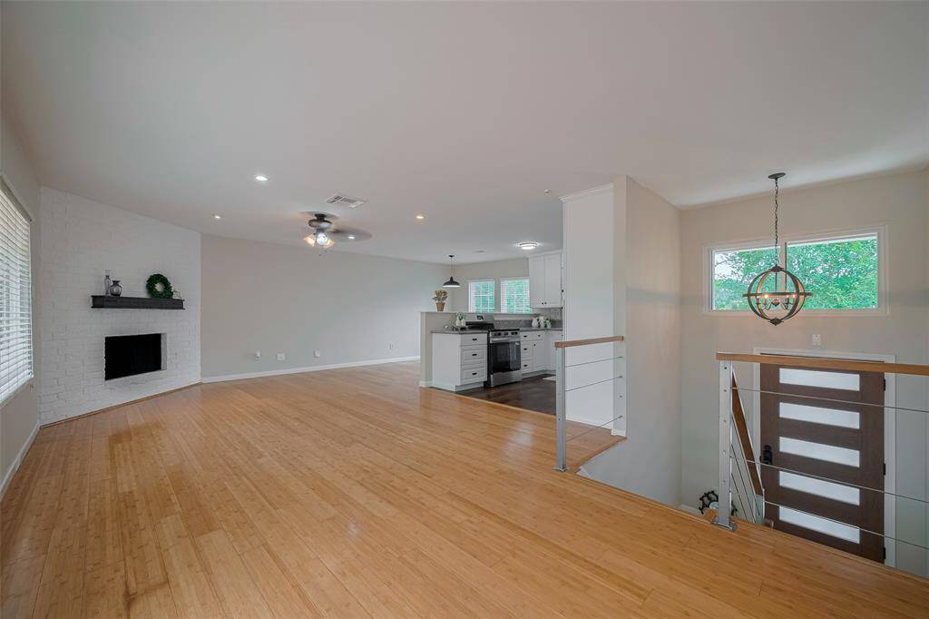 From the entry enter the family room, kitchen and dining room with an expanse of windows letting the sun shine in. The entry to the outdoor deck and patio are from this room.