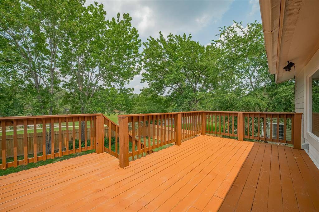 The stairs lead to the backyard and the outdoor covered patio.
