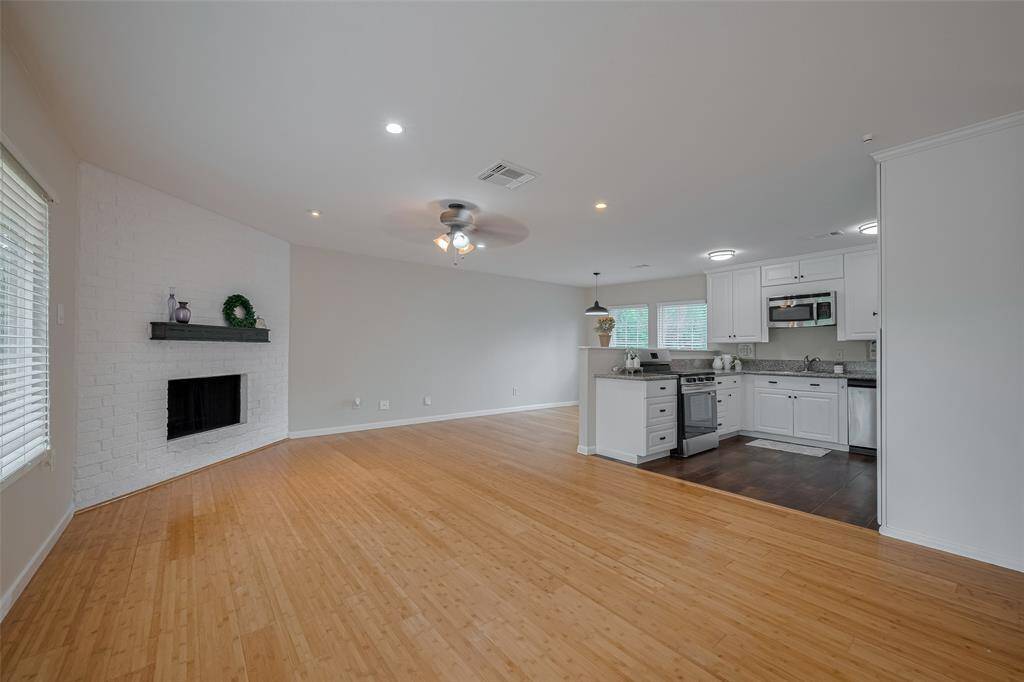The gas fireplace and floating beam mantle are just a few of the upgrades to this home.  There is plenty of space for a large entertaining sofa/loveseat combination or even a large sectional.