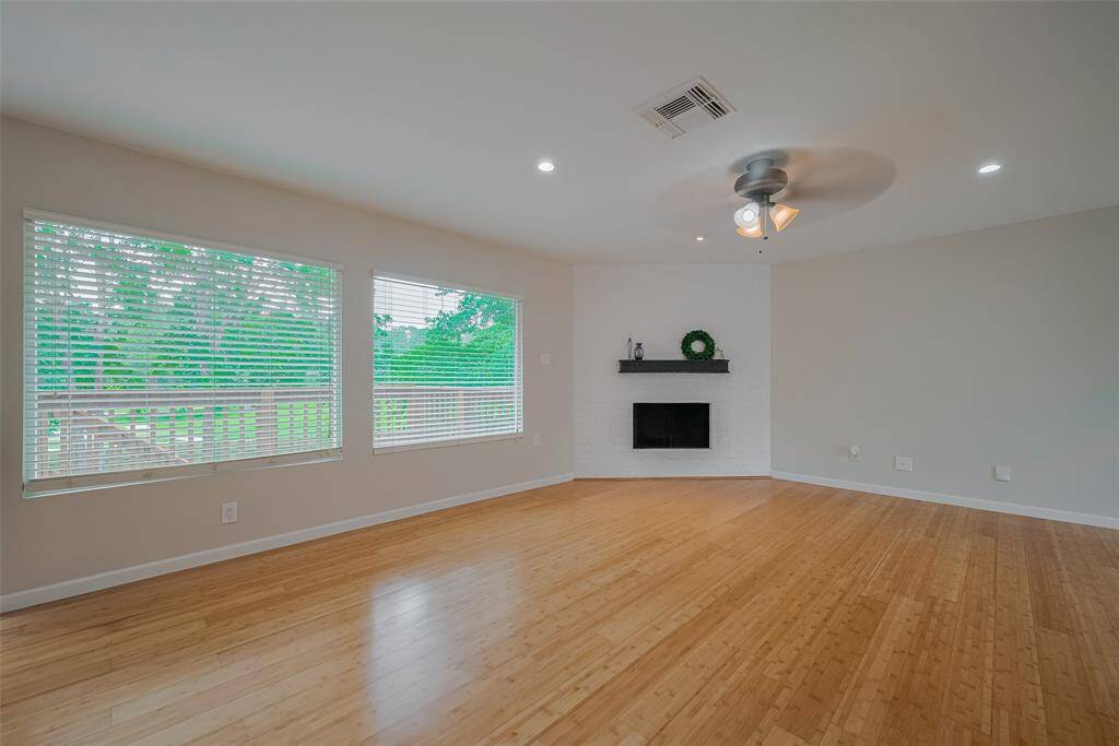 Another view of the large living area and you can see the deck outside that goes downstairs to the covered patio.