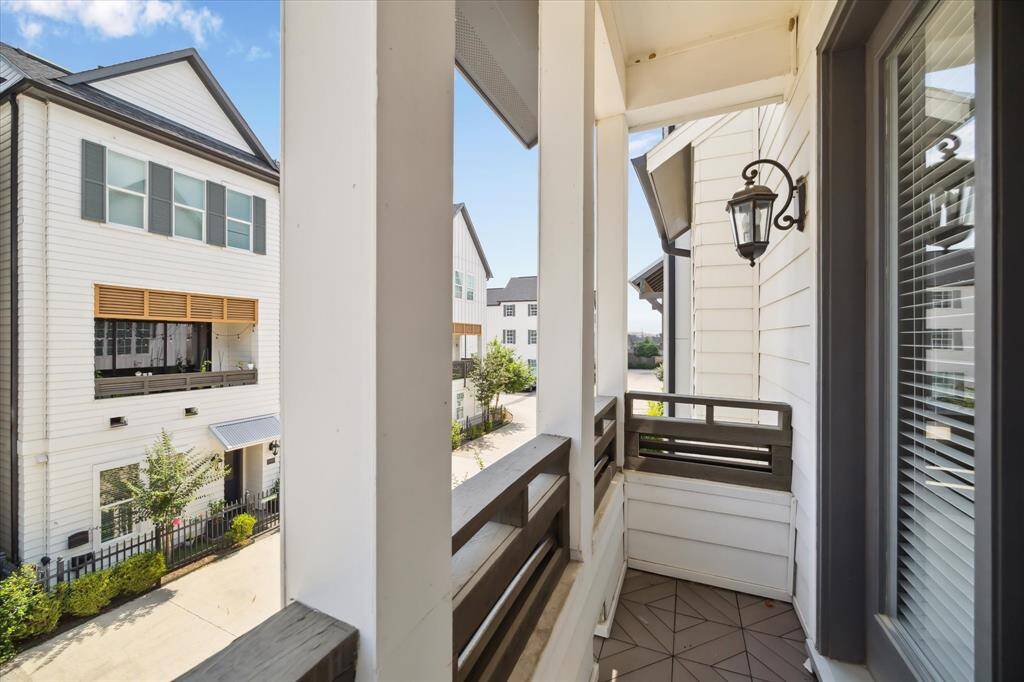 Charming front-facing balcony offers a cozy outdoor nook to enjoy your morning coffee or evening unwind.