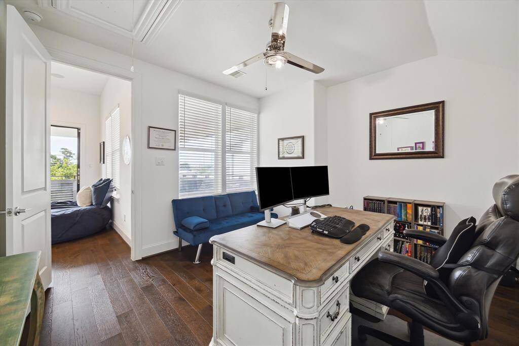 Located on the third floor, this versatile secondary bedroom offers privacy and flexibility—perfect for guests or a quiet home office—with easy access to the top-floor balcony.