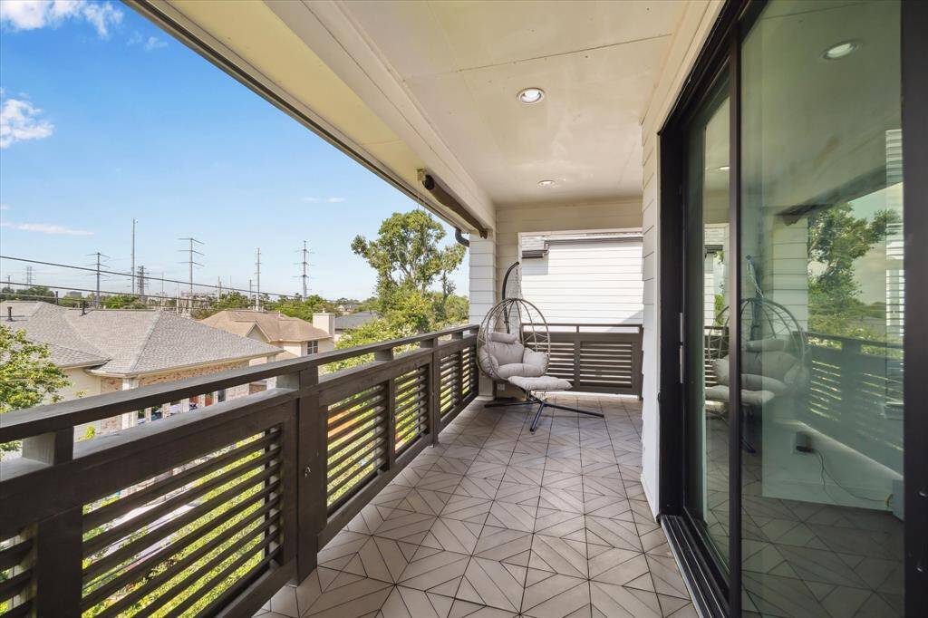 Enjoy elevated outdoor living on the third-floor balcony—an expansive retreat just off the game room, offering neighborhood views and room to relax.