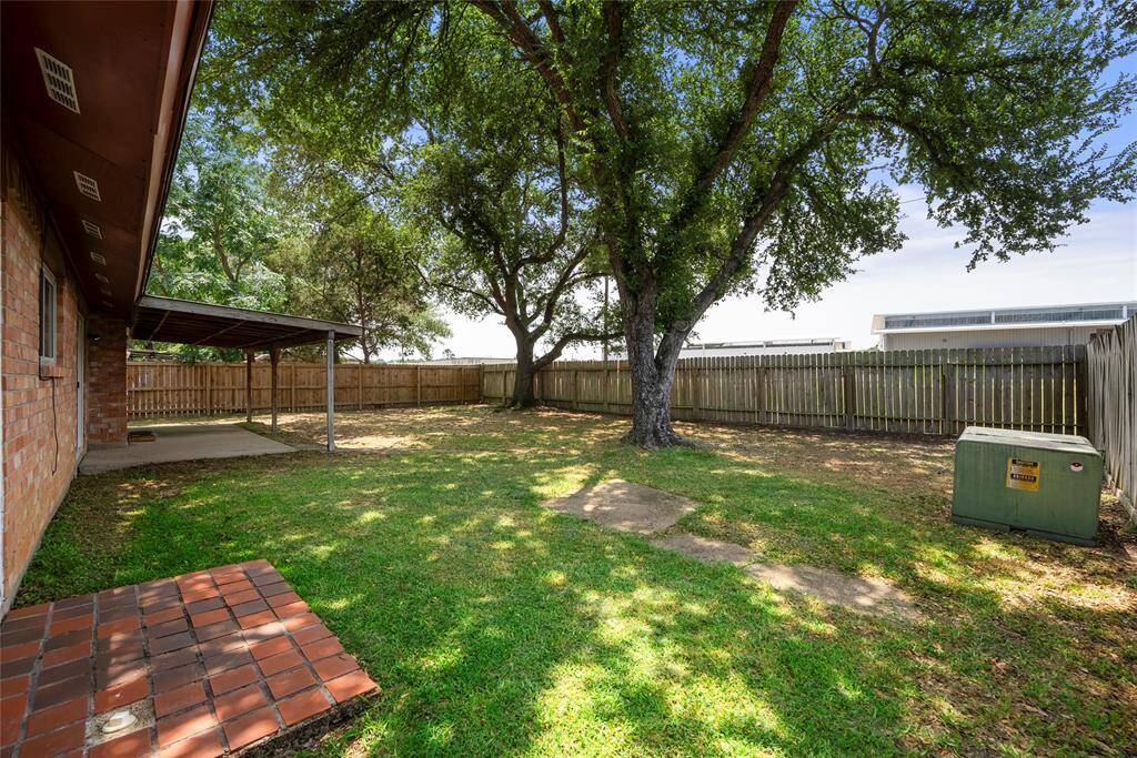 Enjoy the backyard with the mature trees offering plenty of shade.
