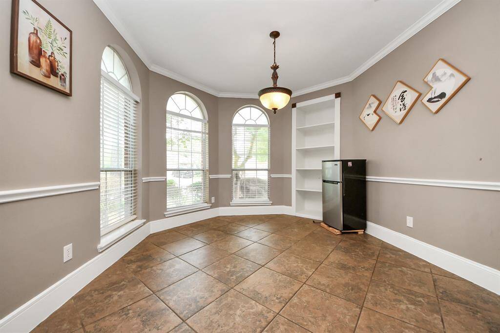 Formal dining with nice bay windows and built-ins.