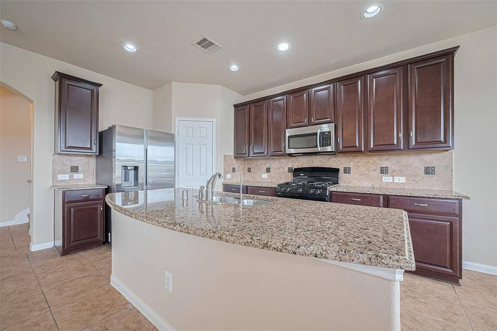 Granite countertops provide a polished look and lasting quality for everyday use or entertaining.