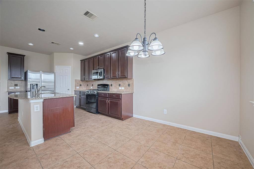 Charming breakfast area with direct access to the backyard—perfect for indoor-outdoor living.