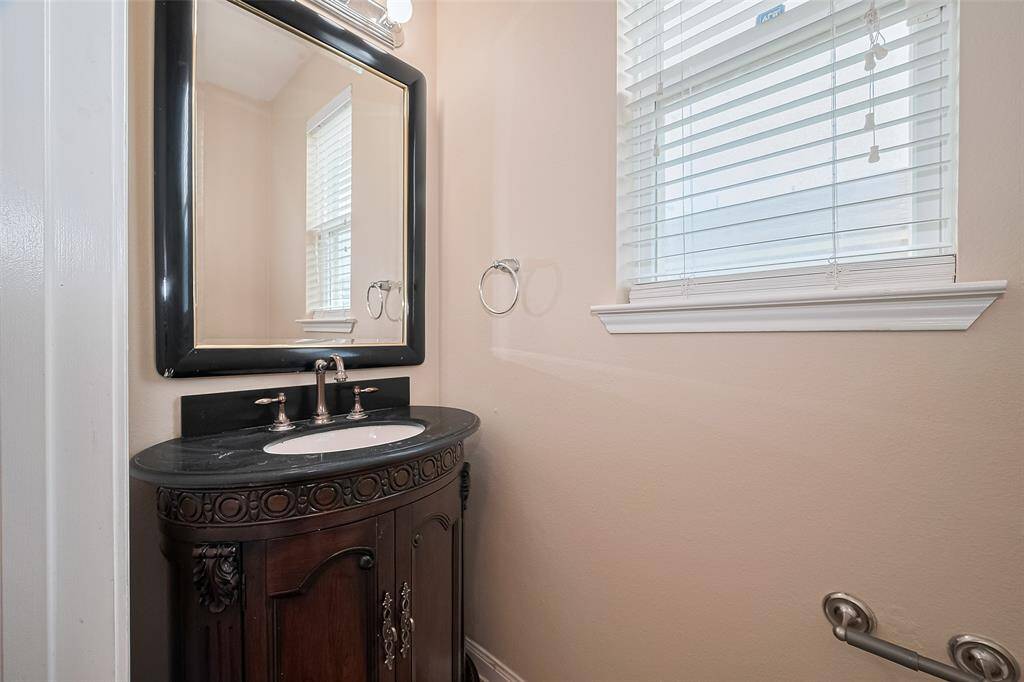 Downstairs powder room offers style and function for everyday living and entertaining.