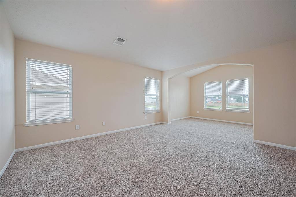 The expansive primary suite features room to unwind in comfort, with space to spare for your favorite furnishings.