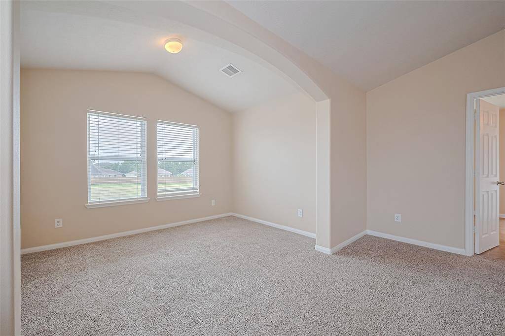 Spacious and serene, the oversized primary bedroom creates the perfect escape at the end of the day.
