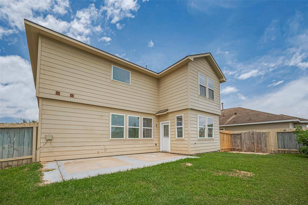 Backyard patio with room for your grill setup—perfect for weekend barbecues and entertaining