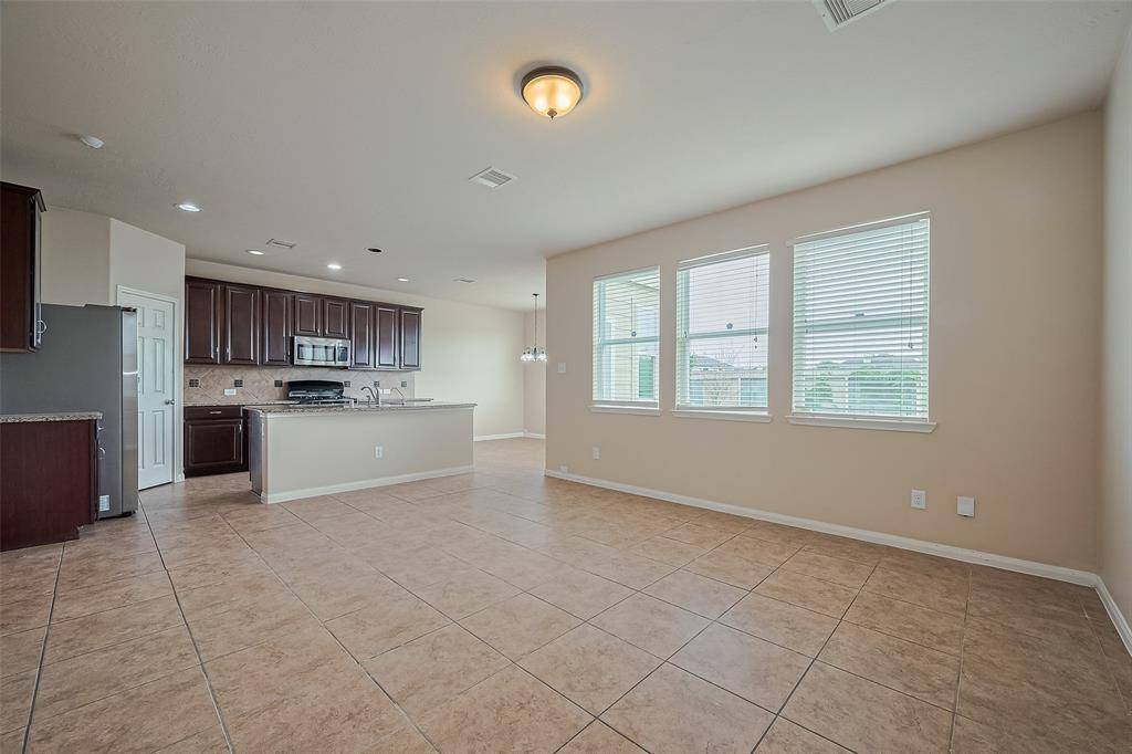 Windows throughout filling your home with natural light.