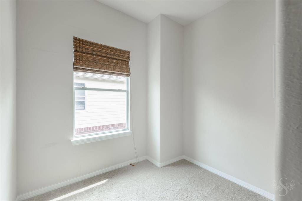 The secondary bedrooms on the second floor offer a perfect blend of comfort and functionality, each designed to provide a cozy retreat for family members or guests. As you step into these rooms, the plush carpet underfoot adds a layer of warmth and softness, enhancing the inviting ambiance.