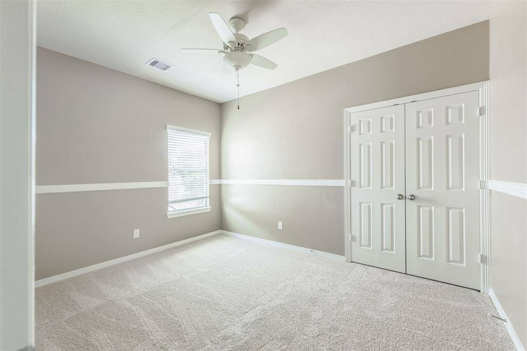 The closets in these secondary bedrooms offer generous storage space, making organization simple and efficient. Overall, these secondary bedrooms are designed with comfort and practicality in mind, ensuring a peaceful and accommodating living space for all who reside in them.