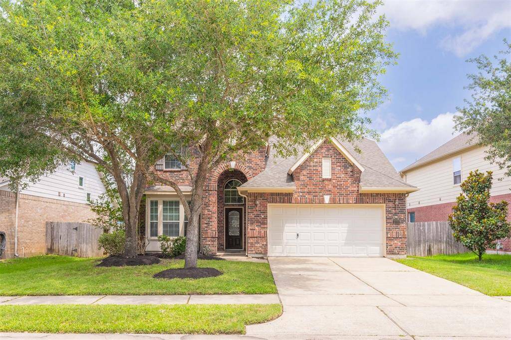 Energy efficiency is a priority in this home, equipped with two thermostats and high-efficiency lighting throughout. The practicality extends to a two-car attached garage, providing ample space for vehicles and storage.