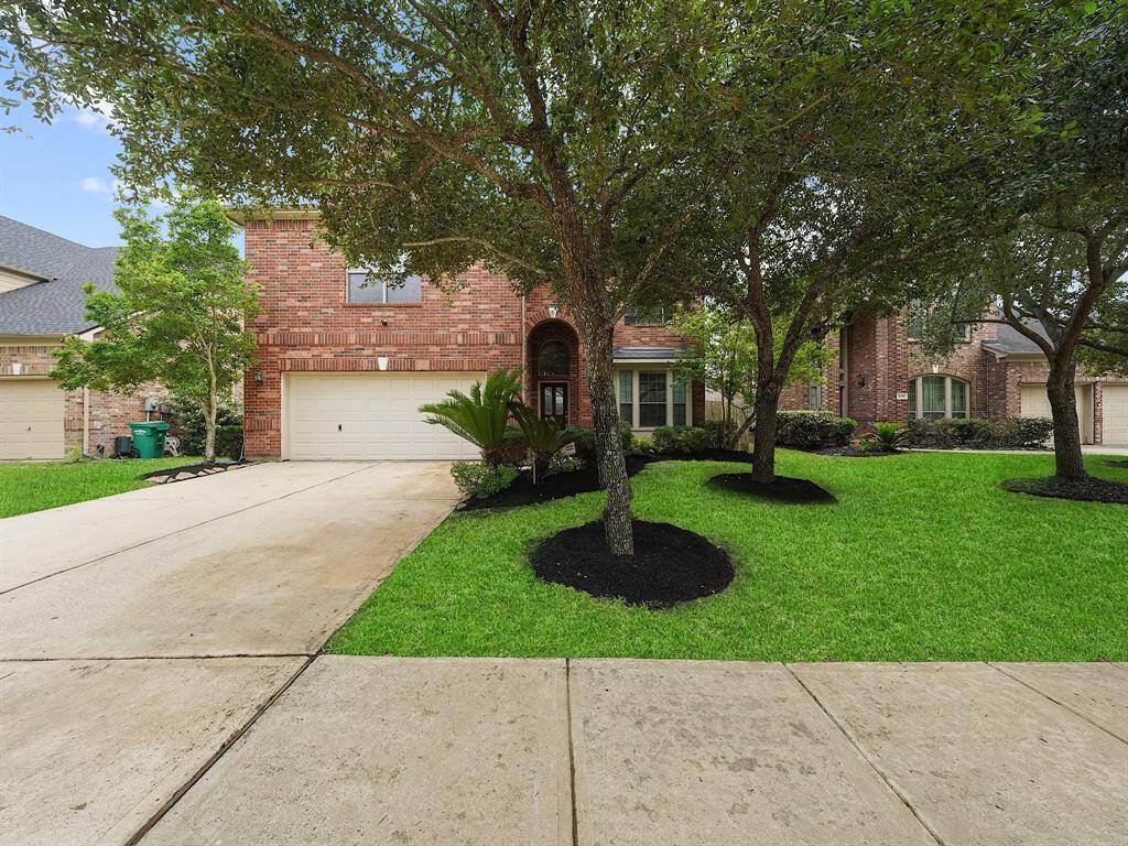 The property features a modern 240V EV charger installed in the garage