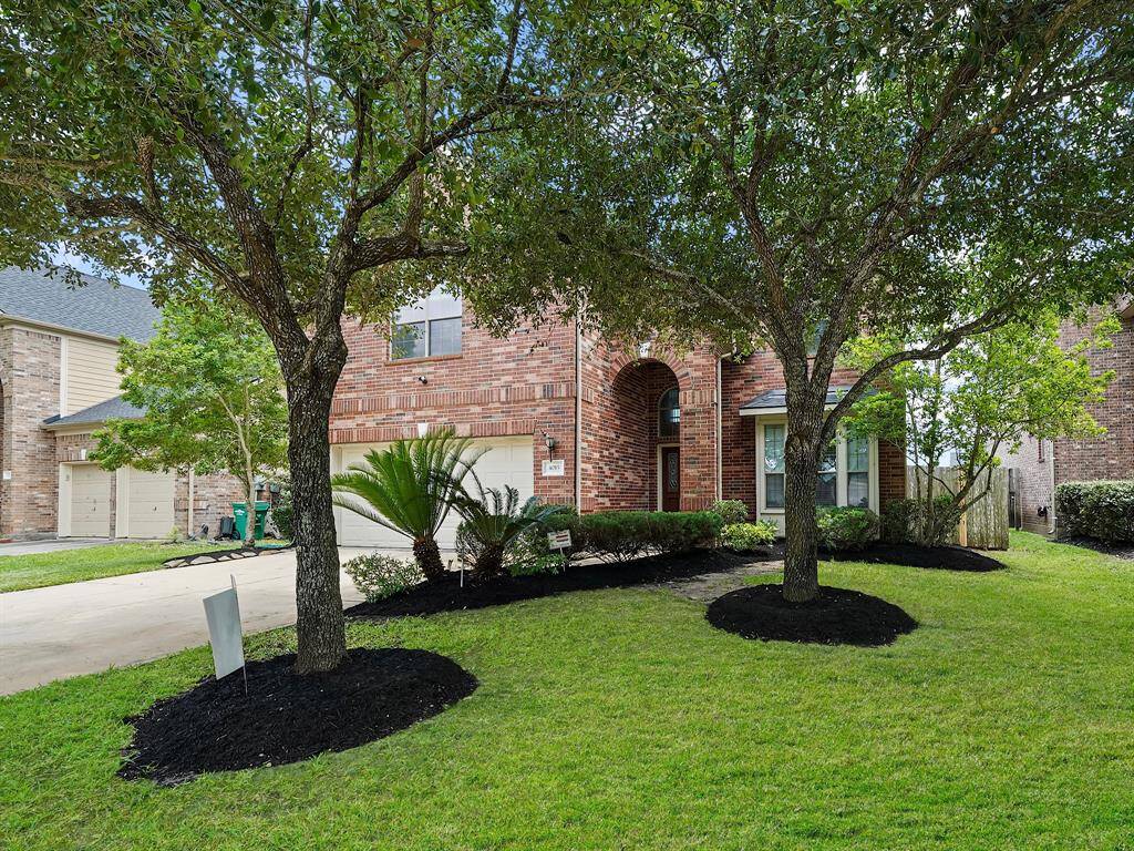Imagine pulling up to a home with captivating curb appeal. Mature trees and meticulously maintained landscaping offer a tranquil and inviting start to your day.