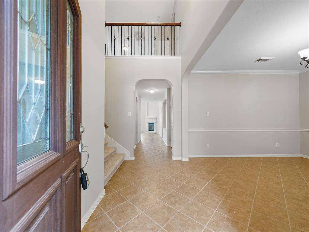 Upon entering, you'll be greeted by a freshly painted interior complemented by the durable tile flooring throughout the main living areas.