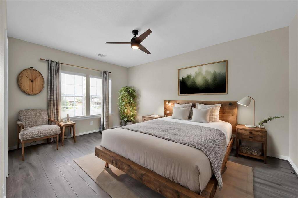 Secondary Bedroom -Disclaimer: This image has been virtually staged to illustrate the property's potential. Furnishings, décor, and enhancements are for visual purposes only and may not reflect actual scale or existing conditions.