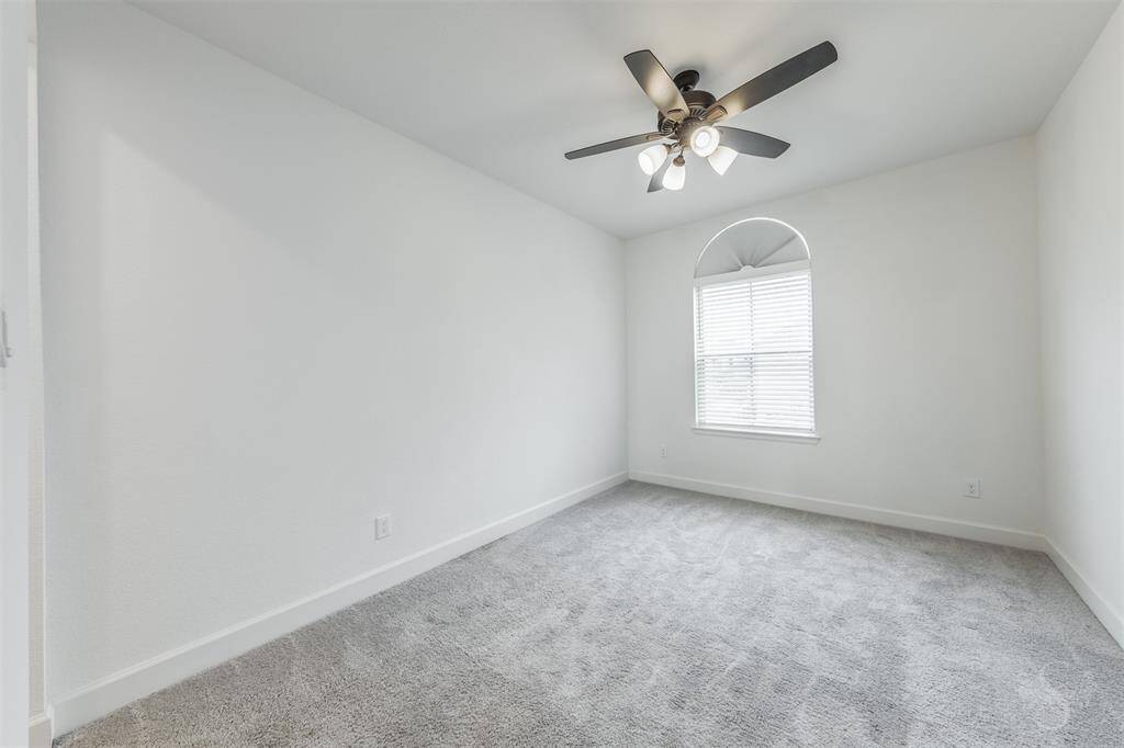 This secondary bedroom provides the space you need for a large bed and any additional furnishings including student desks and bookcases. Featuring plush carpet, high ceiling and window with custom blinds.