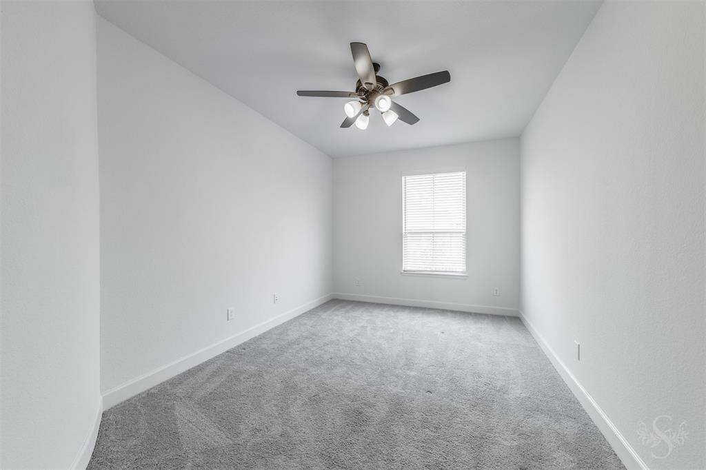 This secondary bedroom provides the space you need for a large bed and any additional furnishings including student desks and bookcases. Featuring plush carpet, high ceiling and window with custom blinds.