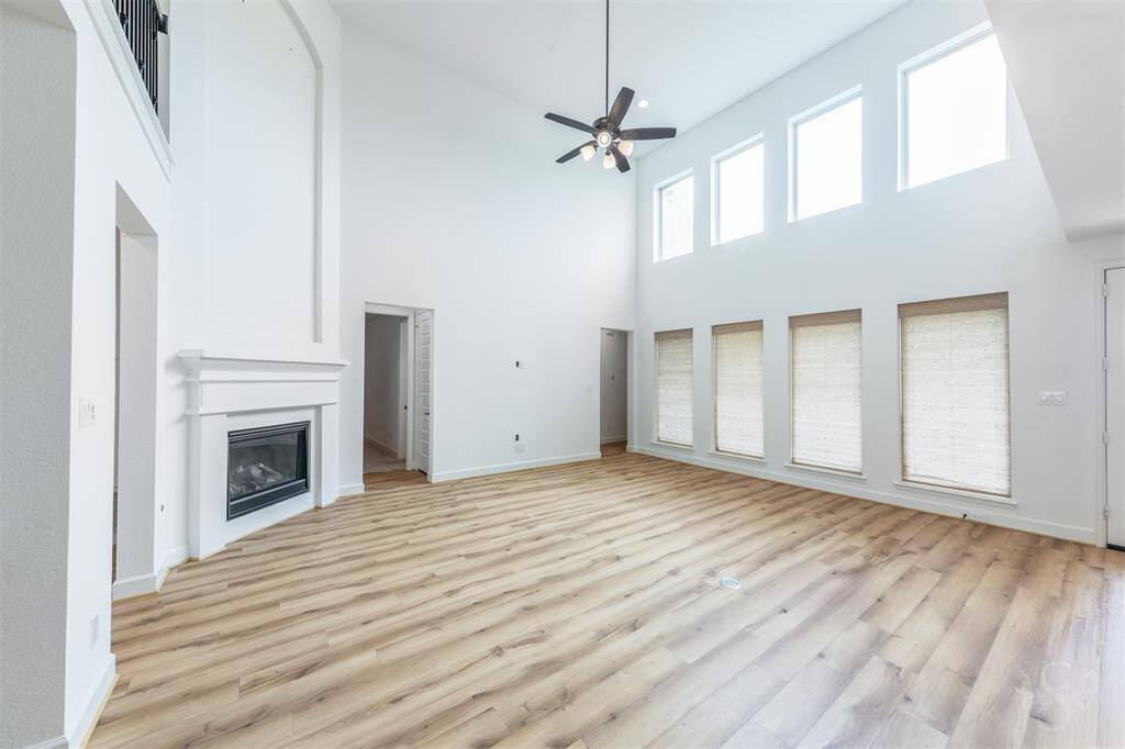 Enjoy abundant sunshine and a sense of grandeur in this spacious family room, where tall windows and vaulted ceilings create a bright and inviting ambiance. With its generous layout, there’s ample room for oversized furniture, cozy conversation areas, and effortless entertaining for large gatherings.