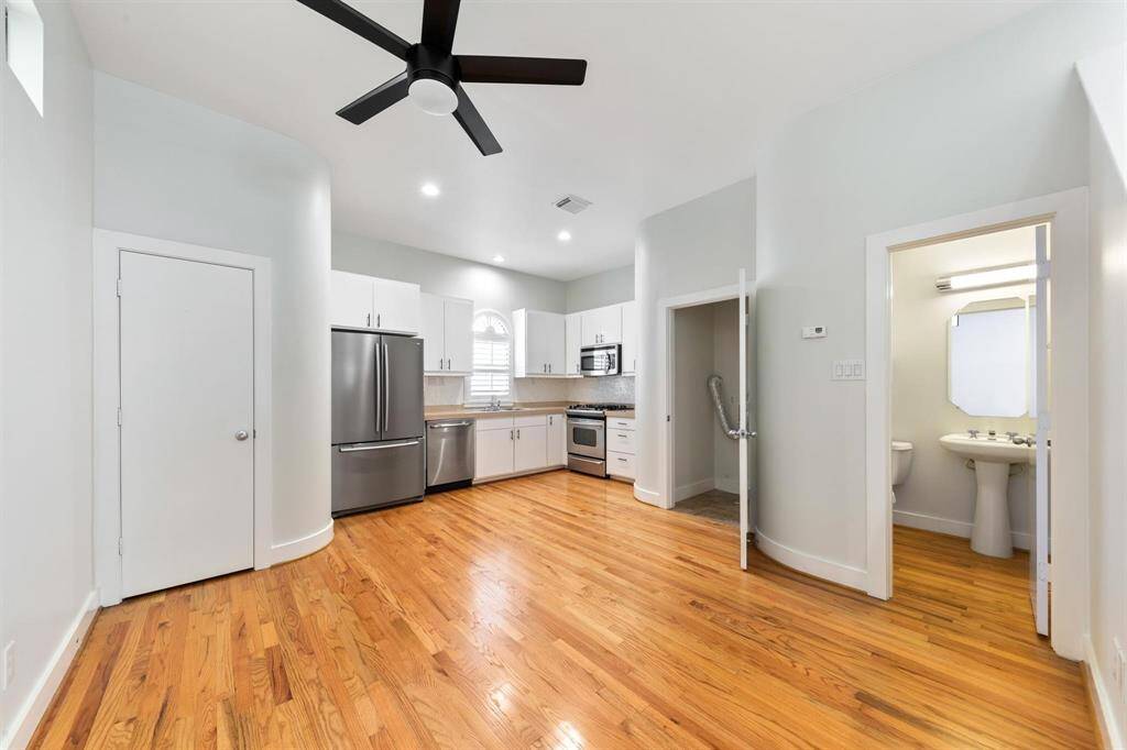 Kitchen with dedicated dining space and direct access to a half bath—all in one open, functional layout designed for everyday convenience