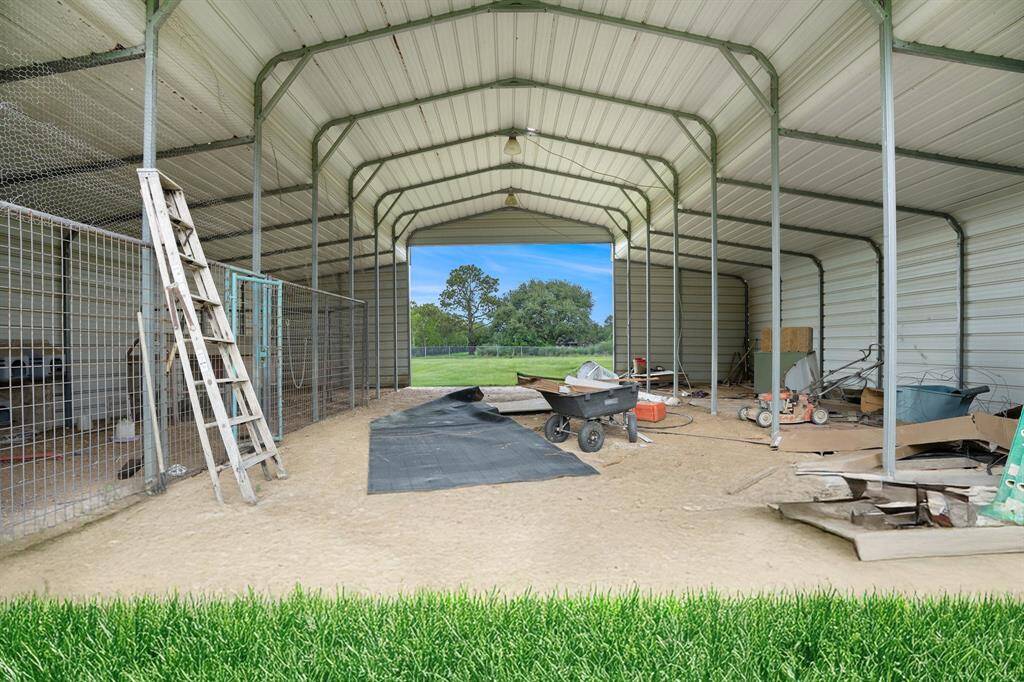 Inside the barn/stable there are stalls and plenty of space for storage.