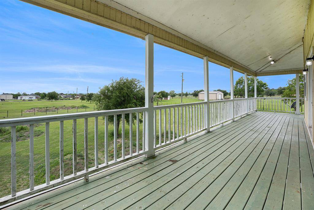 This porch is just waiting for some chairs, a corner hammock, a couple of tables and some TX sweet tea!