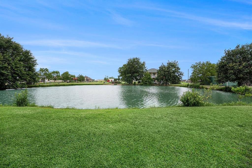 The pond is approximately 13' deep at it's center, with some good sized fish that know when it's feeding time and come up to be fed by the seller.