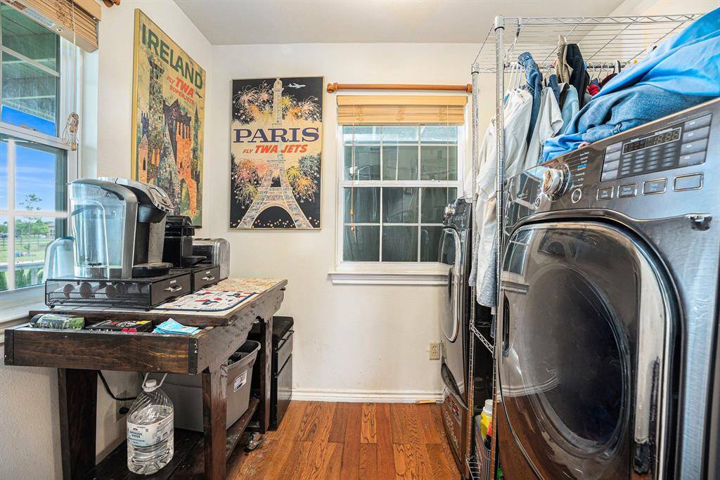 The laundry room is located off of the kitchen and has ample room for full size washer & dryer, and plenty of space for extra storage, or a coffee bar.