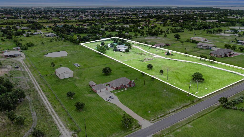 Property consists of 5 +/- acres, which includes a pond, carport, buried 250 gallon propane tank, water well, aerobic septic, and a barn/shop. Situated mid-center of the front half of the property, is an approximate 120'x 90' pad-site added by previous owners.