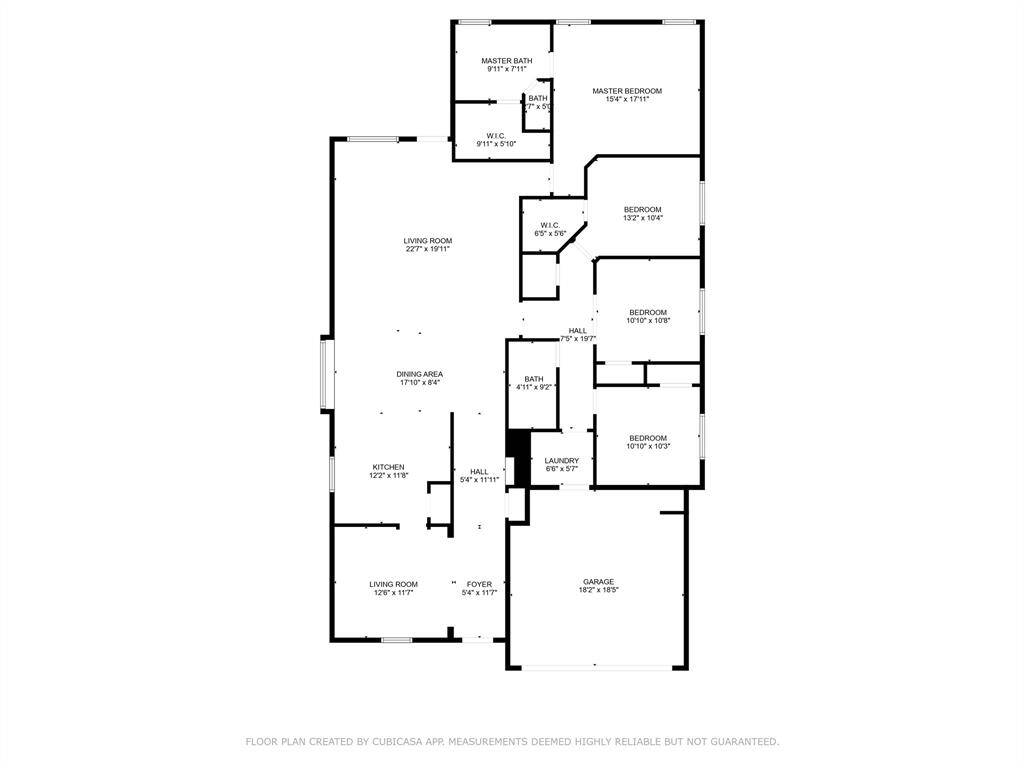 This floor plan features a spacious layout with four bedrooms, including a master suite with an en-suite bath. The open living and dining areas are adjacent to a well-sized kitchen. Additional highlights include a separate laundry room, a foyer, and a two-car garage. Perfect for family living.