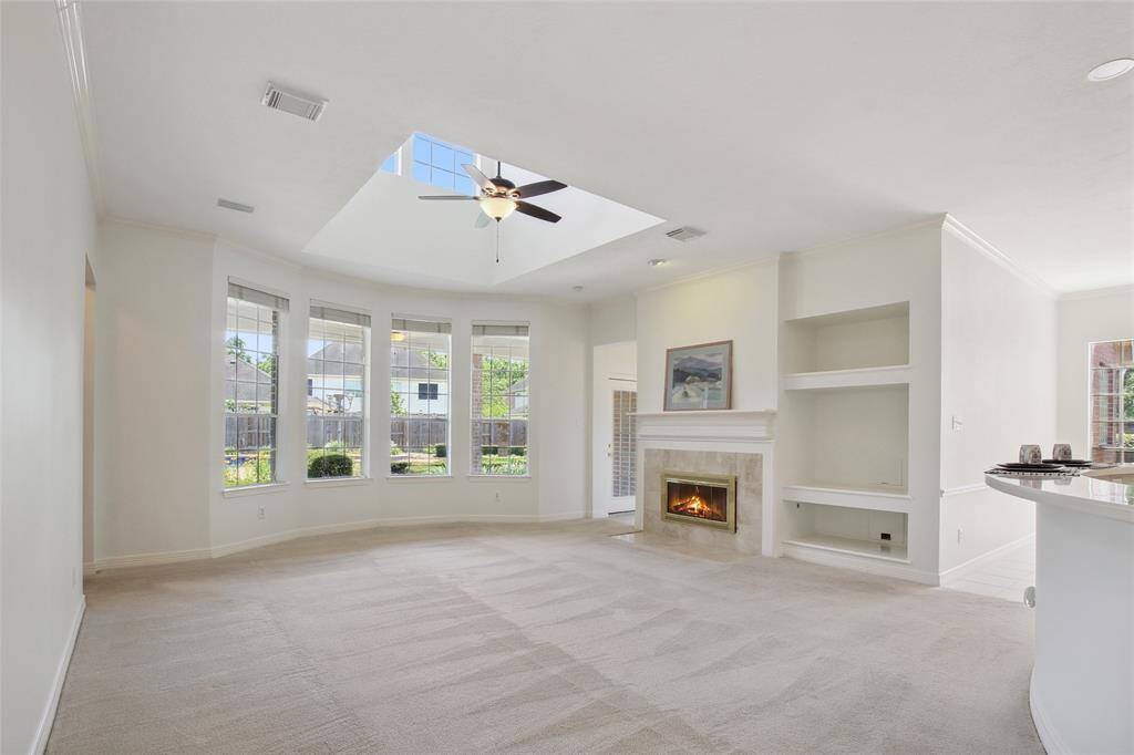Spacious Family Room open to the Gourmet Kitchen and views of back yard oasis.