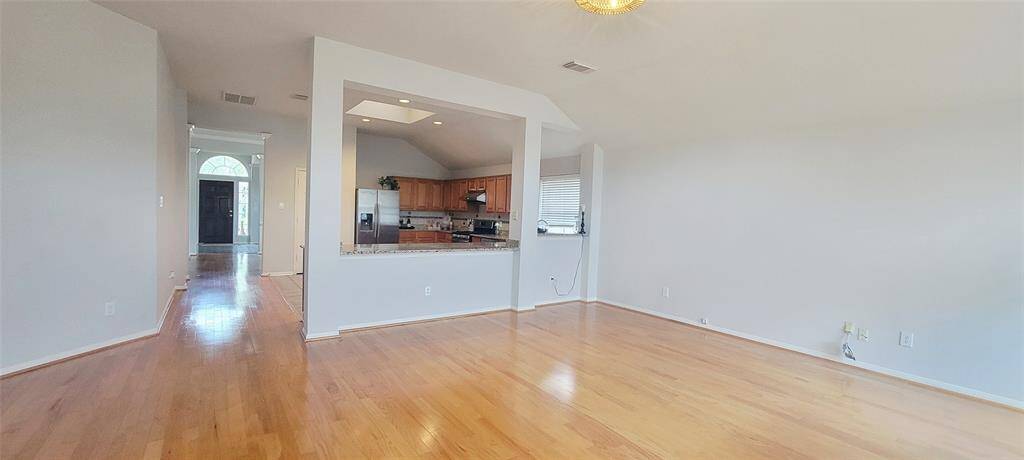 Open kitchen has skylight.