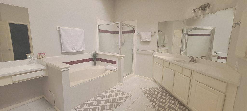 Large master bath has skylight.
