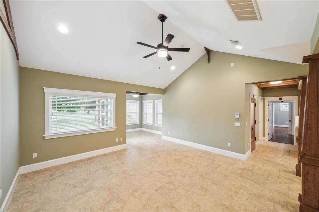 THIS VIEW IS FROM THE SECONDARY BEDROOMS LOOKING ACROSS THE SPLIT FLOOR PLAN TOWARDS THE PRIMARY SUITE