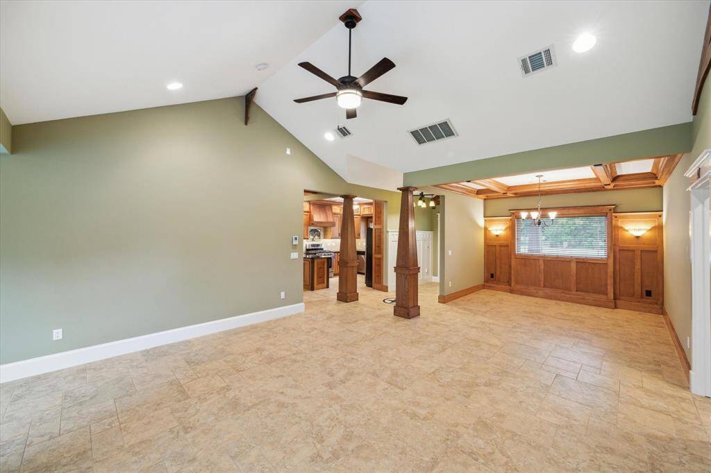 CUSTOM MADE PILLARS ADD STYLE AND GRACE BETWEEN FOYER , DINING, KITCHEN AND FAMILY ROOM