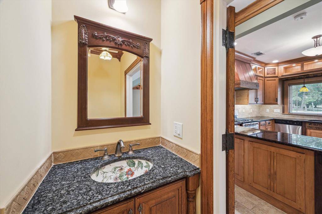 POWDER ROOM OFF OF THE KITCHEN IS CONVENIENTLY LOCATED
