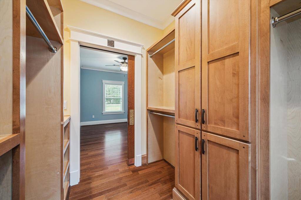 THE STYLISH POCKET DOOR TO PRIMARY CLOSET OFFERS A SEAMLESS TRANSITION- A PERFECT ENHANCMENT TO THE ROOM LAYOUT