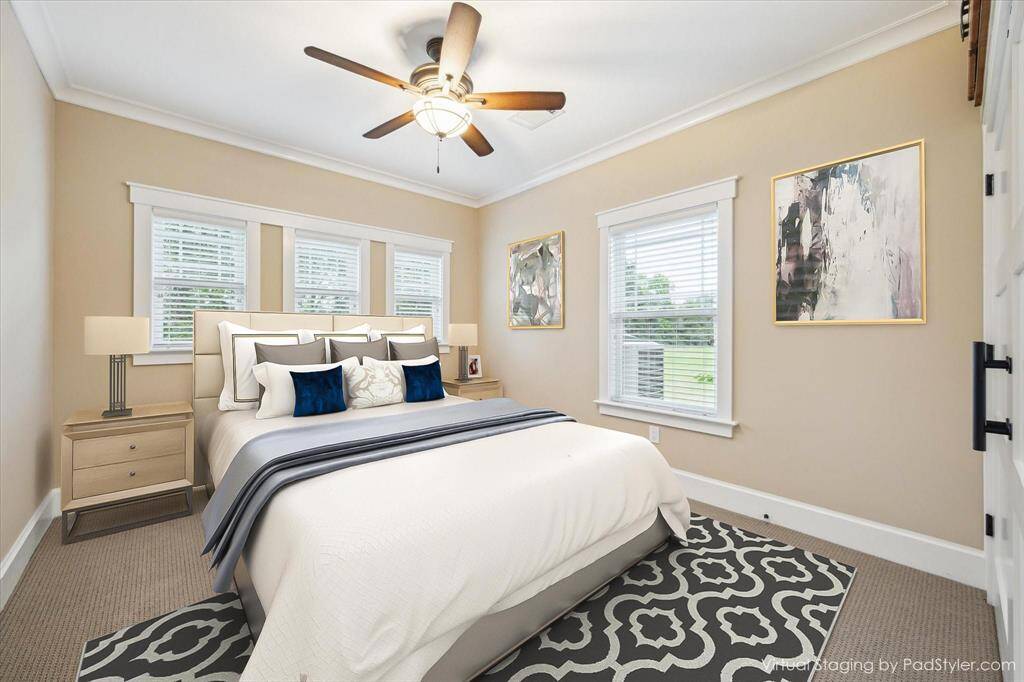 NEW CARPET, AND CUSTOM WINDOW BORDERS ARE ONLY A FEW FEATURES TO THE THIRD BEDROOM. THIS ROOM IS SOUND PROOF FOR THE PERSON WHO NEEDS A QUITE SPACE AND HAS VIEWS OUT TO THE BACK GREEN SPACE OF THE PROPERTY
