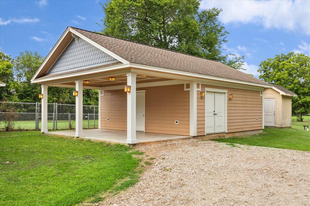 THIS SECONDARY AIR CONDITIONED VERSATILE BUILDING HAS 576 SQ FT OF ENDLESS POSSIBILITIES. JUST BEHIND IT, THE WELL HOUSE SITS NEATLY TUCKED AWAY. THE ATTICK IN THIS BUILDING IS FULLY DECKED.