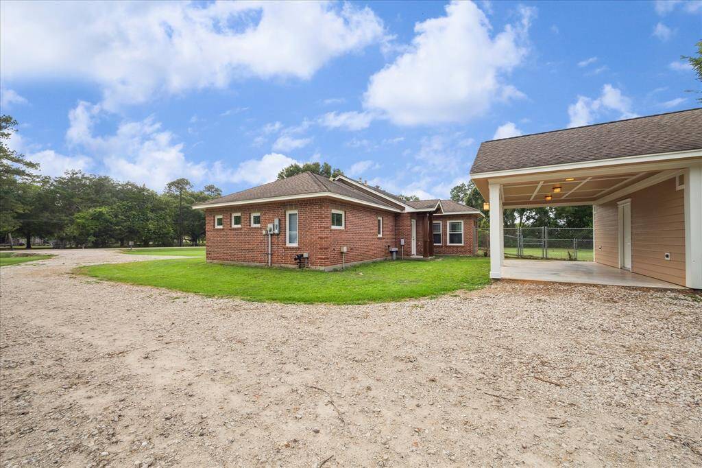 ON THE RIGHT SIDE OF THE HOME, A FIRMLY PACKED DRIVEWAY OFFERS EASY ACCESS AND LEADS TO A SPACIOUS SECONDARY BUILDING- PERFECT FOR WORKSHOP,STORAGE AND GAME ROOM. IT OFFERS A CHARMING PORCH PROVIDING ADDITIONAL SPACE TO RELAX