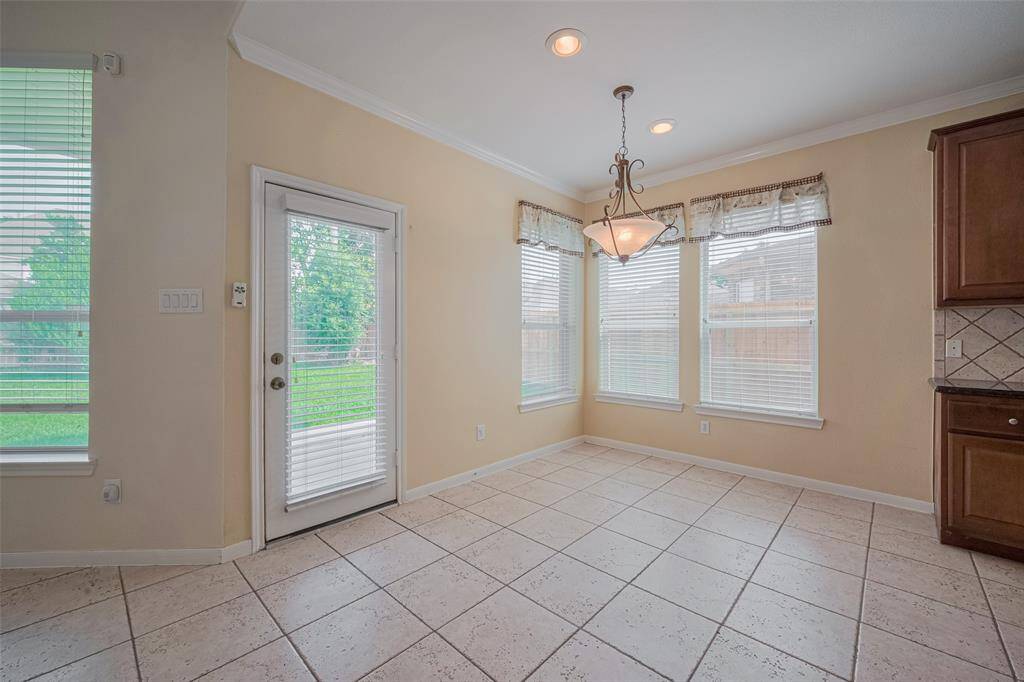 Breakfast area and door leading to the patio