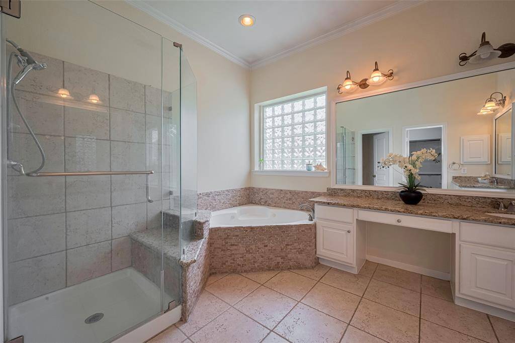 Separated shower and jet tub in primary Bedroom