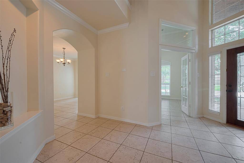 Den leading to formal dining and Study