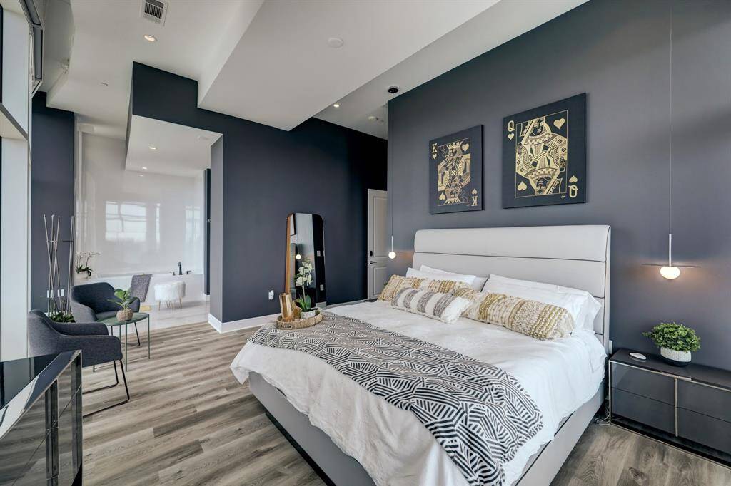 The primary suite with large walk in and large windowed bath.