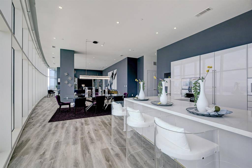 A view of the forward thinking curved wall of the Arabella maximizing the homes views while touching the sky.